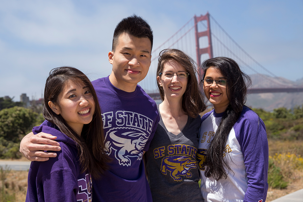 San Francisco State University student smiling in from to the Golden Gate Bridge