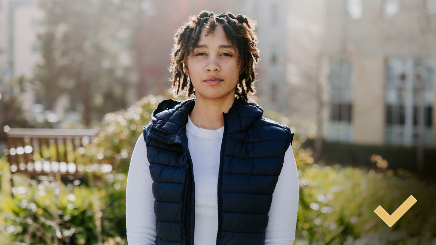 a profile photo of a student in the outdoors with back-lighting